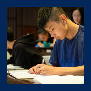 a young person writing an exam