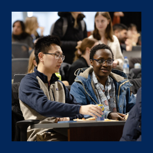 Two students in a lecture hall